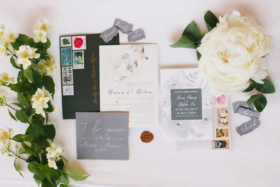 photo of wedding invitation and florals