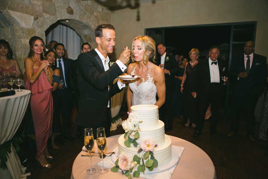 cake cutting at Malibu Rocky Oaks Wedding | One Love Wedding Photographer