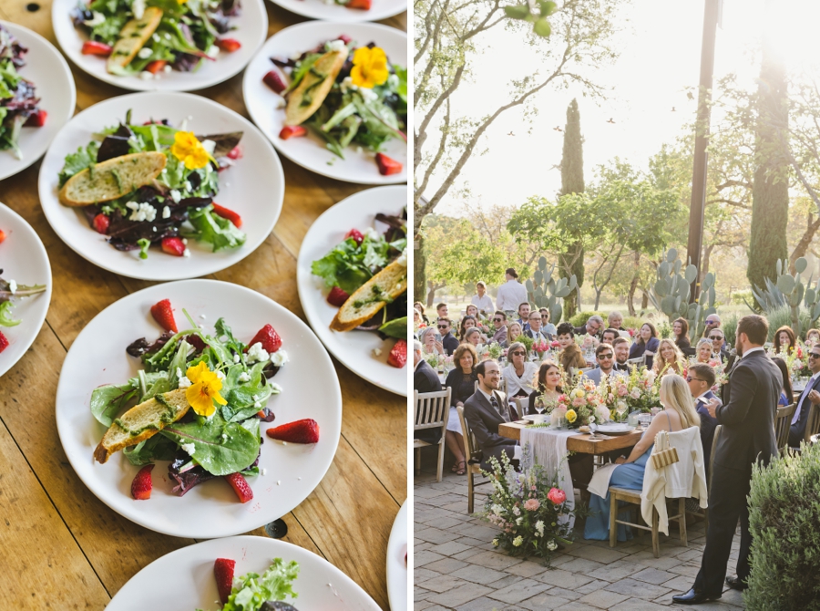 A colorful salad plate and a long table of wedding guests eating dinner
