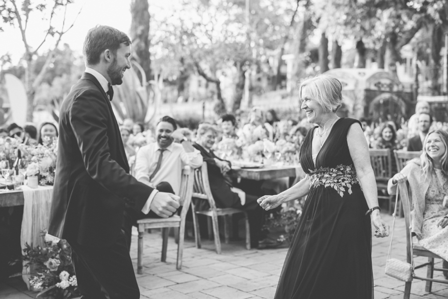 A black and white photo of a groom dancing with his mother at Triple S Ranch in Napa